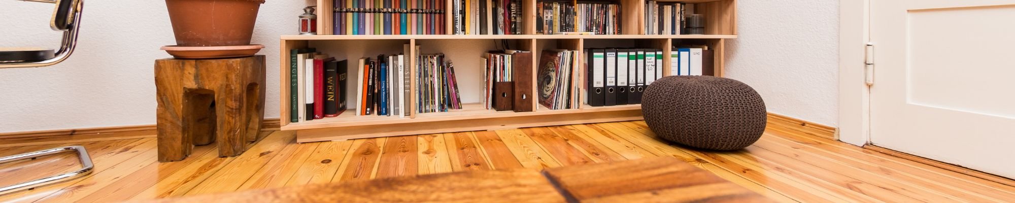 hardwoord floor in living room with bookcase